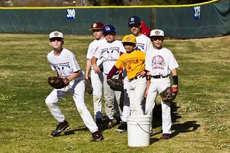 Campers in ready position during a fielding drill