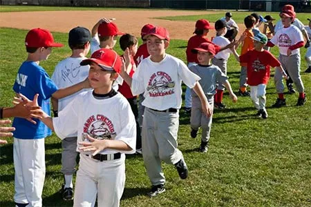 Campers high-fiving after a team game