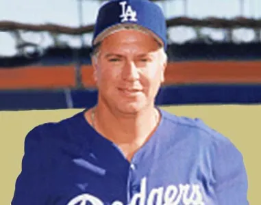 Mark Cresse smiling in his Los Angeles Dodgers cap and jersey